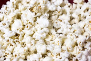 Delicious and fluffy popcorn kernels in a close-up shot ready to enjoy.